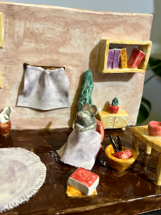 Fermalibri topino in salotto