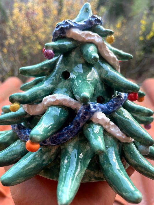 Albero piccolo decorativo e portacandela