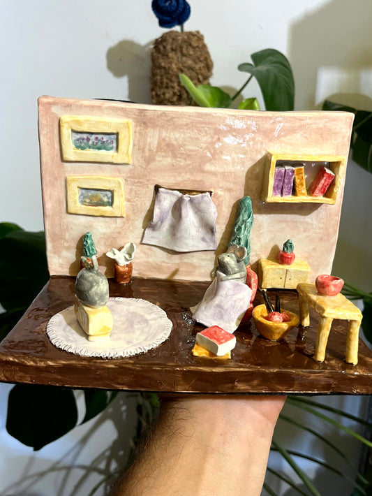 Fermalibri topino in salotto